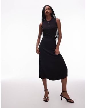 ARKET Robe mi-longue sans manches extensible avec col boutonné et ceinture - Noir
